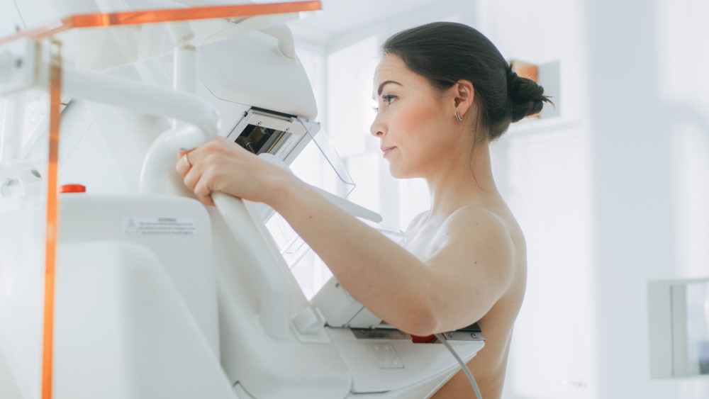 Woman getting a contrast enhanced digital mammography