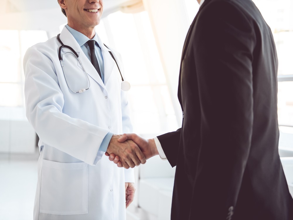 Doctors shaking hands at radiology office